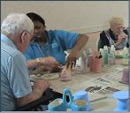 Residents paint ceramic pots