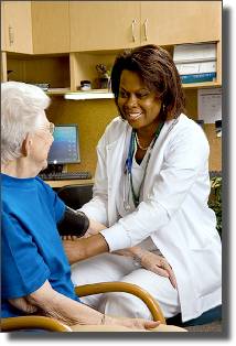 Nurse takes patient’s blood pressure